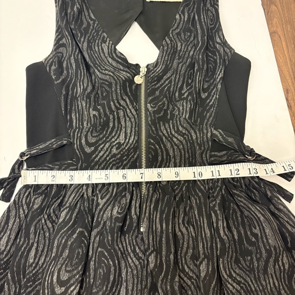 Lipsy Black sleeveless dress with a cool pattern, zipper, hooks and buttons. - Picture 10 of 10